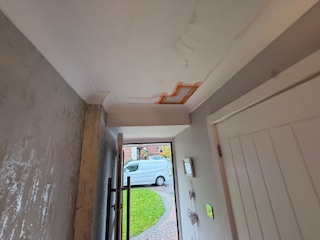 Ceiling patchwork repair near entrance