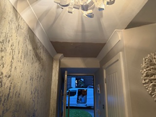Hallway with completed plaster ceiling and decorative finish